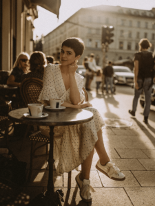 Woman sitting at outdoor cafe