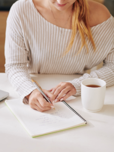 Woman writing in a notebook