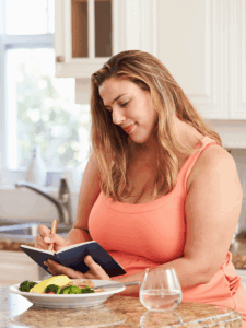 woman food journalling